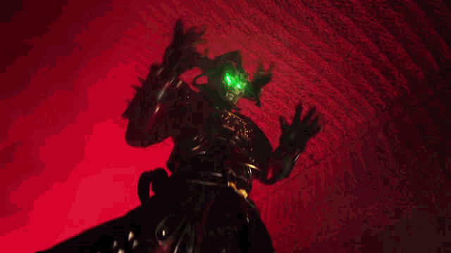 a man in a costume with a green light on his face
