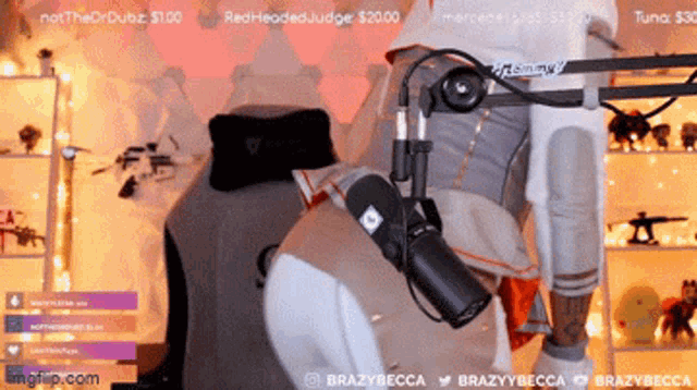 a woman is standing in front of a microphone with the words brazybecca at the top