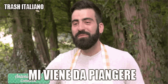 a man with a beard is wearing a white shirt and an apron and says trash italiano