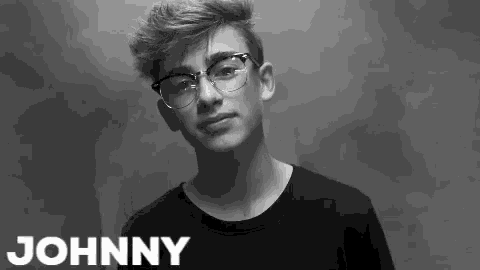 a black and white photo of a young man with the name johnny above him