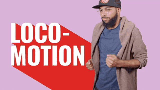 a man wearing a hat and glasses is standing in front of a sign that says loco motion