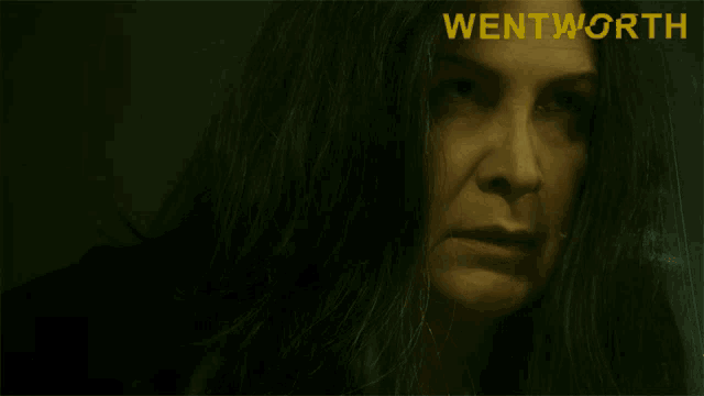 a poster for wentworth shows a woman with dark hair