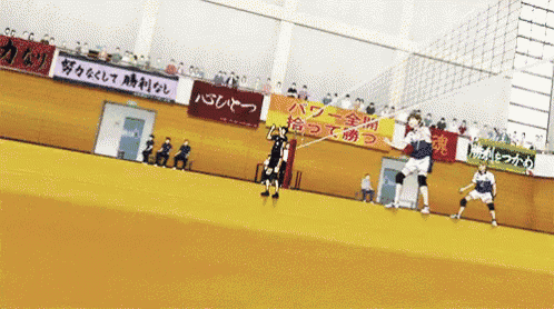 a volleyball game is being played in a stadium with a sign that says ' a ' on it