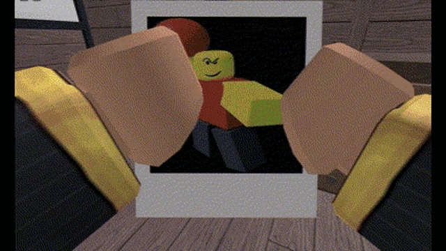 a picture of a roblox character is being displayed on a wooden floor .