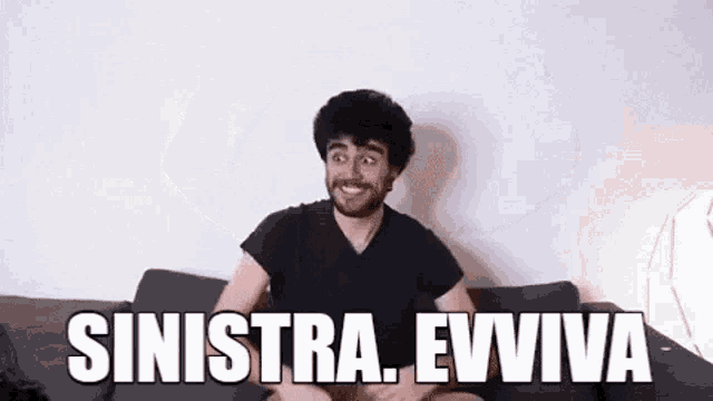 a man with a beard is sitting on a couch with the words `` sinistra . evviva '' written on it .