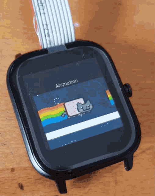 a smart watch with a cat on the screen and the word animation on the bottom