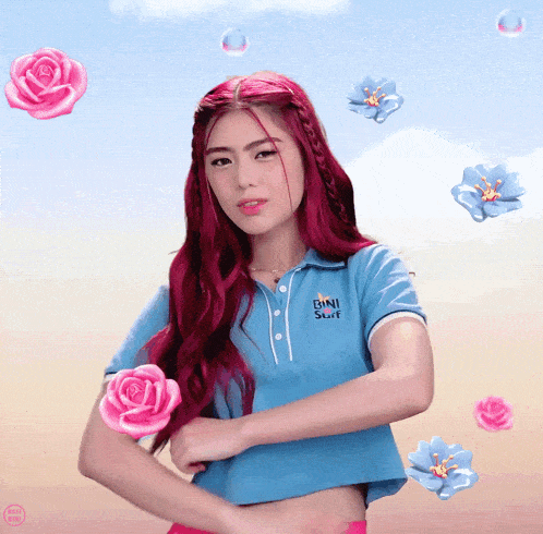 a woman with red hair is wearing a blue shirt that says ' pink sun ' on it