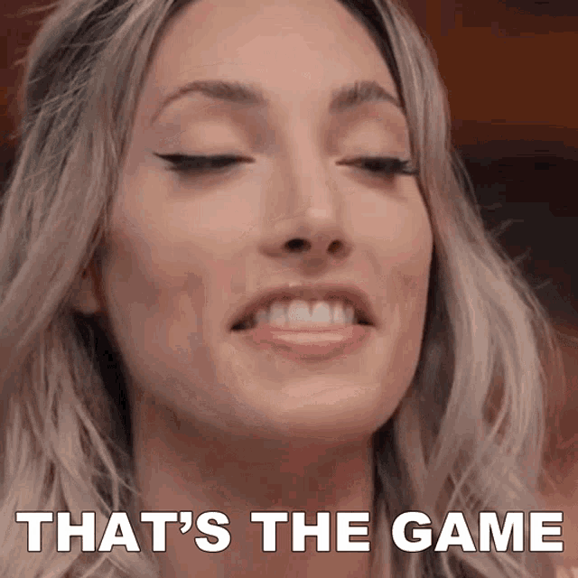 a close up of a woman 's face with the words that 's the game above her