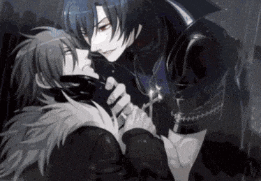 a man with a cross necklace is holding another man 's neck
