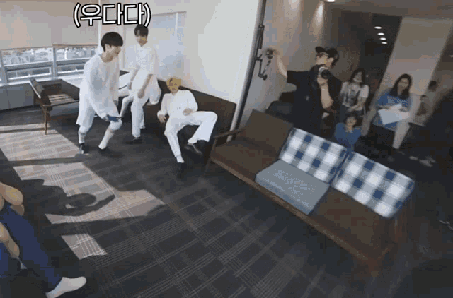 a group of people sitting on a couch with a sign above them that says ' ( ) ' on it