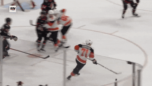a hockey game is being played with a sn logo in the corner