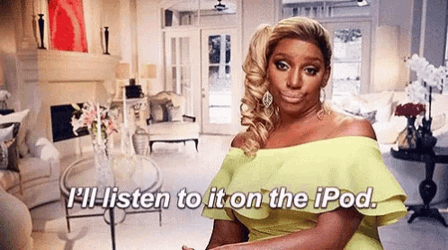 a woman in a yellow dress is sitting in a living room with the words `` i 'll listen to it on the ipod ''