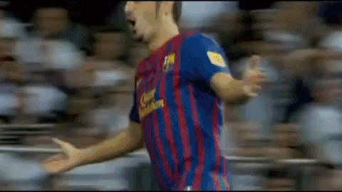 a blurry picture of a soccer player wearing a jersey that says ' barcelona ' on it