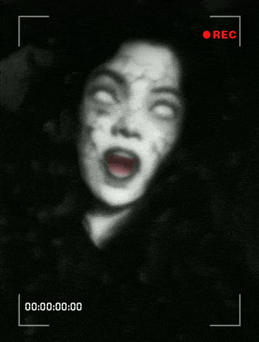 a black and white photo of a scary woman with white eyes and a rec button