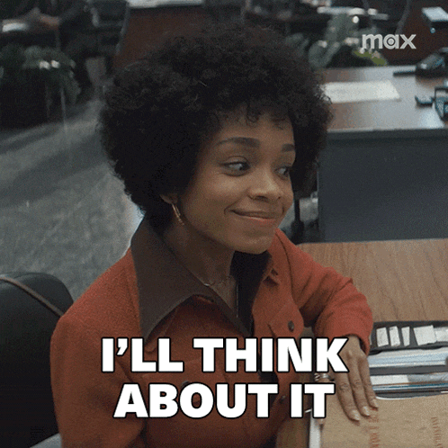 a woman sitting at a desk with the words i 'll think about it on her face