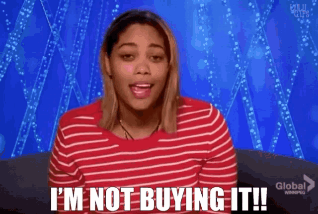 a woman says i 'm not buying it while wearing a red striped shirt