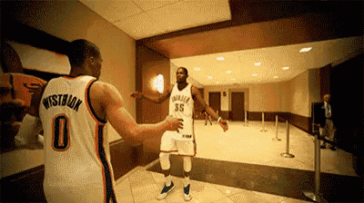 two basketball players one of whom has the number 35 on his jersey