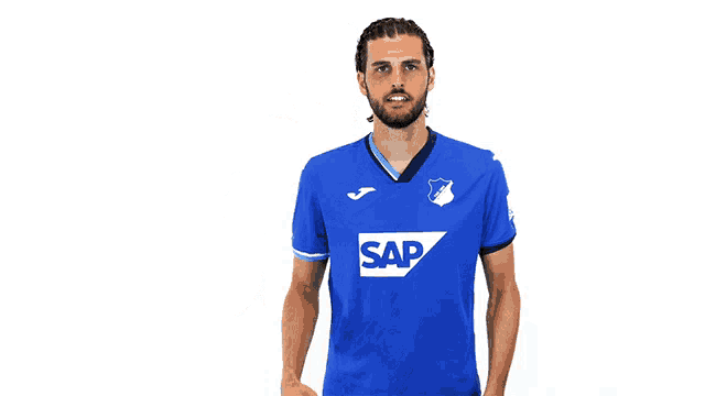 a man is wearing a blue shirt with the word sap on it