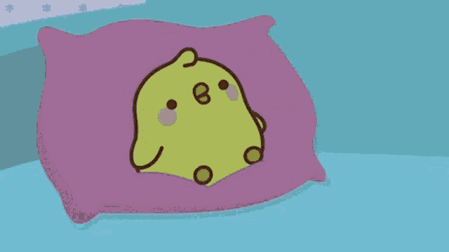 a cartoon chicken is sleeping in a bed with a blanket on it .
