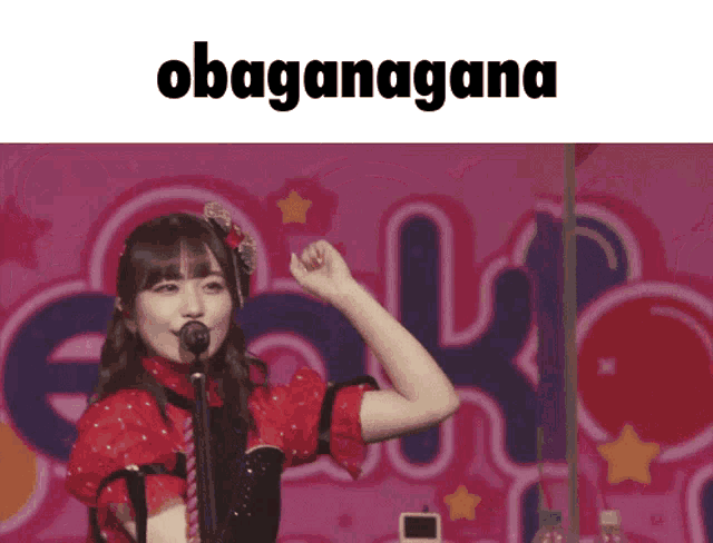 a girl singing into a microphone with the word obaganagana written above her
