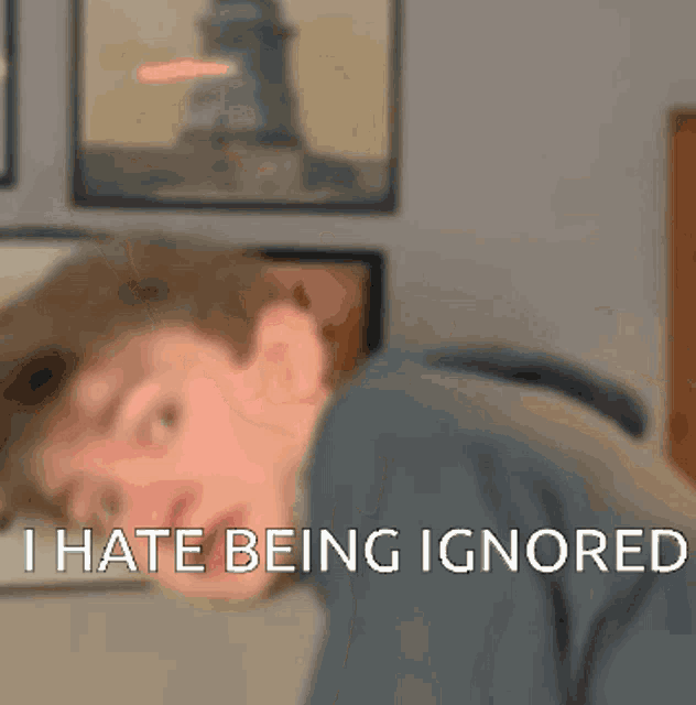 a blurry picture of a man with the words " i hate being ignored " written on the bottom