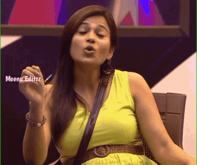 a woman in a green dress with meenu editzz written on the bottom left