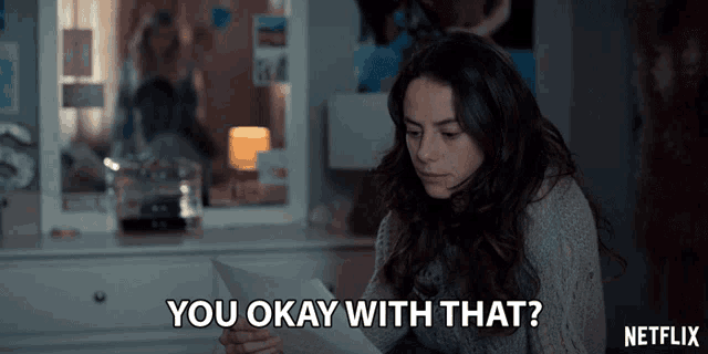 a netflix advertisement shows a woman holding a piece of paper and saying " you okay with that "