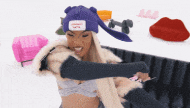 a woman wearing a purple beanie that says loverboy