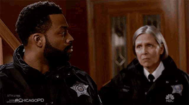 a man and a woman are standing next to each other with the hashtag #chicagopd in the corner