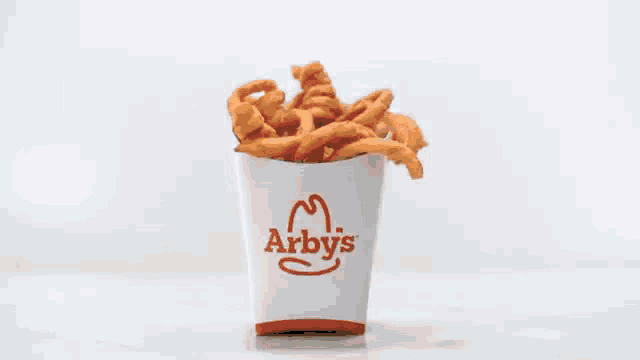 a close up of a piece of food being thrown into the air .