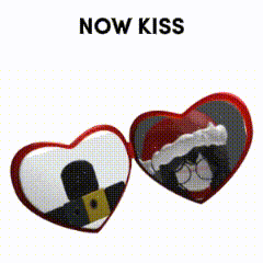 two heart shaped mirrors with the words now kiss on top of them