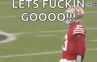 a football player wearing a red jersey with the number 13 on it is jumping in the air on a field .