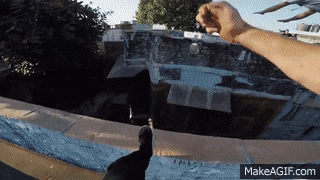 a person 's arm is visible in front of a makeagif.com watermark