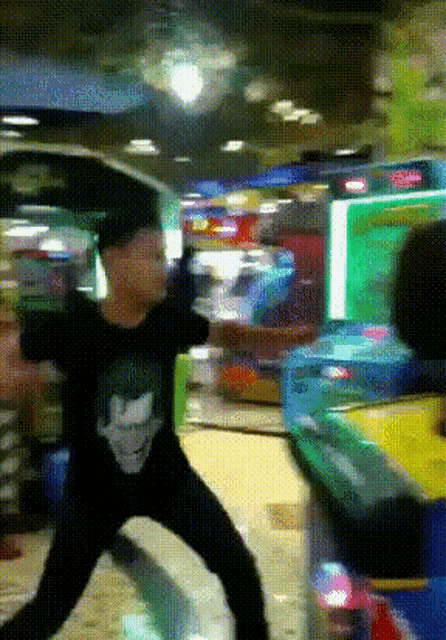 a man in a black shirt with a picture of a man on it