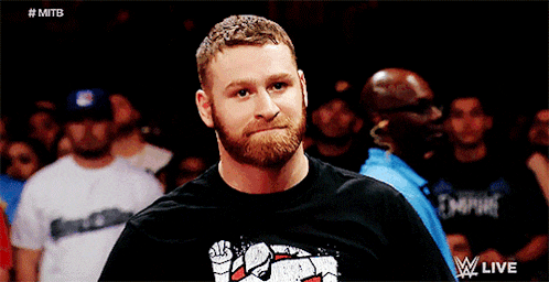 a man with a beard wearing a black shirt that says empire