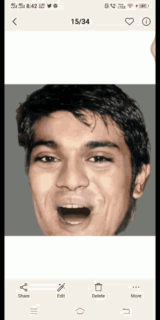 a phone screen shows a man with his mouth open