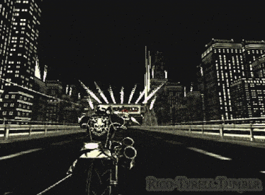 a man riding a motorcycle in front of a mad world sign