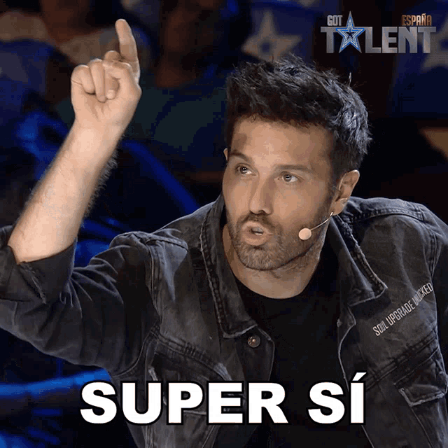 a man wearing a denim jacket with the word super si on the bottom