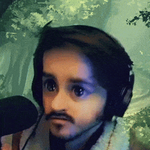 a man with a beard is wearing headphones and a microphone