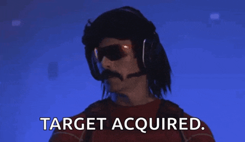 a man with a mustache is wearing headphones and sunglasses and says target acquired