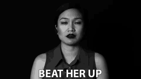 a black and white photo of a woman with the words beat her up written on the bottom .