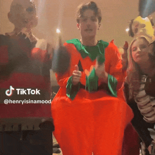 a man in a pumpkin costume is giving a thumbs up in a tiktok