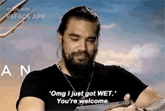 a man with a beard is holding a tablet and saying `` omg i just got wet . ``