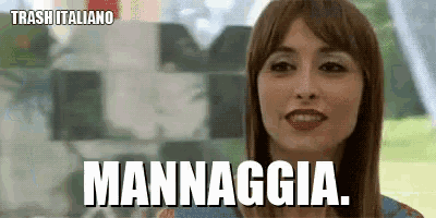 a woman is smiling and says mannaggia in a foreign language