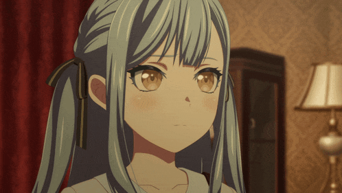 a close up of a girl 's face with a lamp behind her