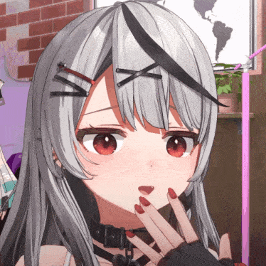 a close up of a girl 's face with a surprised look on her face