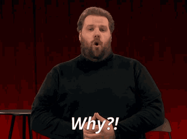 a man with a beard is making a funny face and saying why