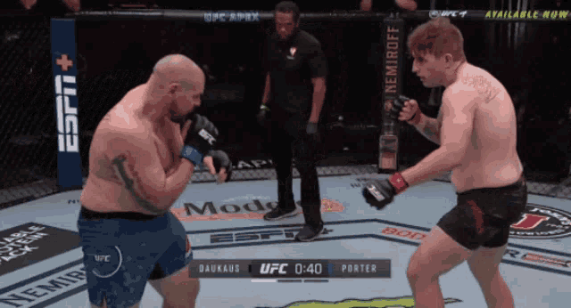 two men are fighting in a boxing ring with a espn logo in the background