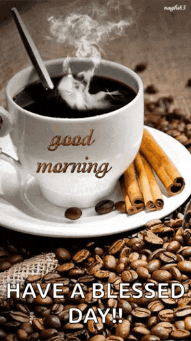 a cup of coffee on a saucer that says good morning on it