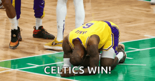a basketball player with the number 9 on his jersey is kneeling on the court